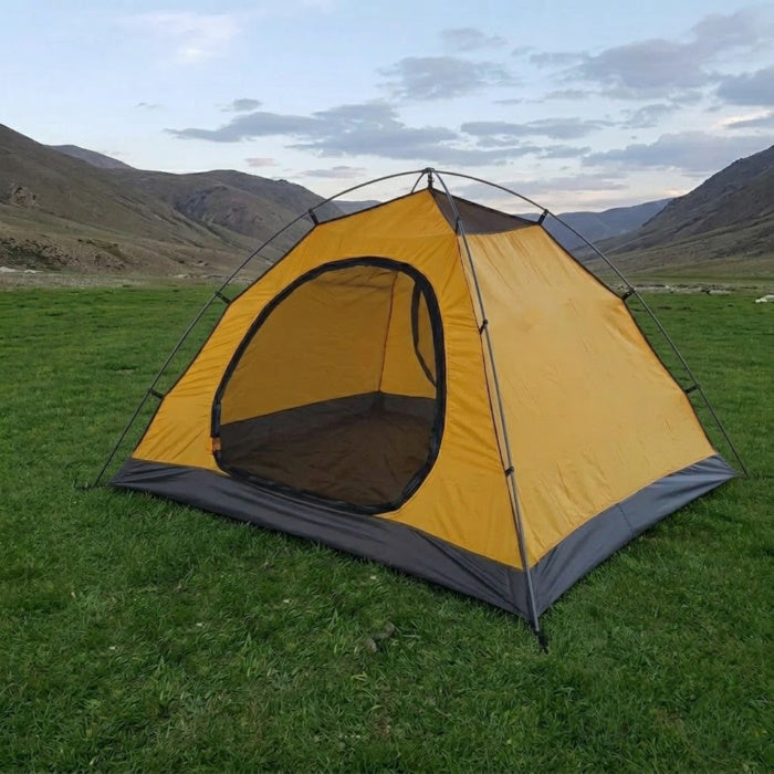 Load image into Gallery viewer, Yellow and gray tent set up on a grassy field with mountains in the background