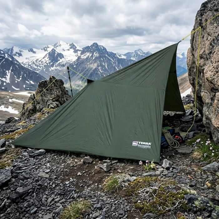Load image into Gallery viewer, Waterproof mountain shelter tarp secured with guy lines in rocky terrain