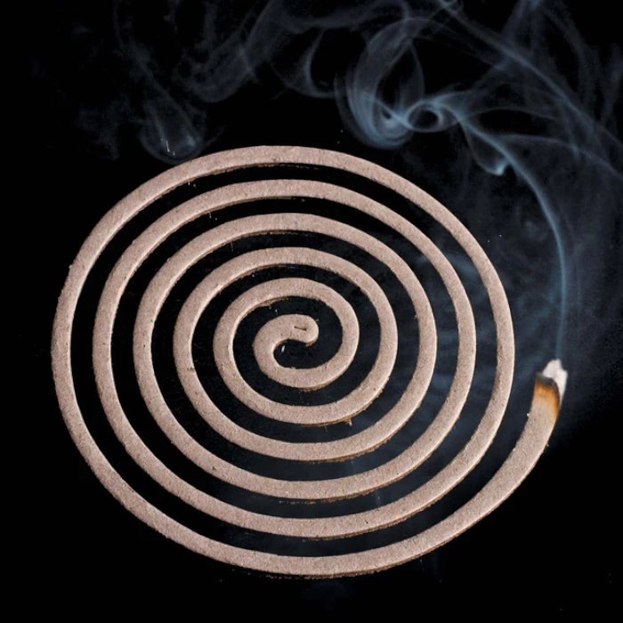 Load image into Gallery viewer, Top view of a smoldering Lifesystems mosquito coil releasing repellent smoke
