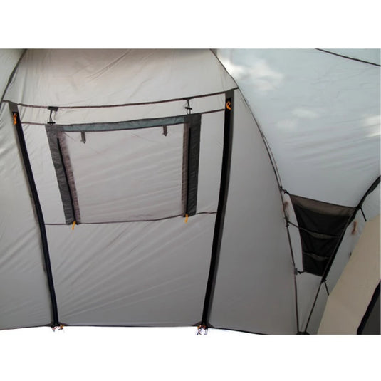 Internal wall of Grand 5 tent featuring a mesh window and fabric storage tiers