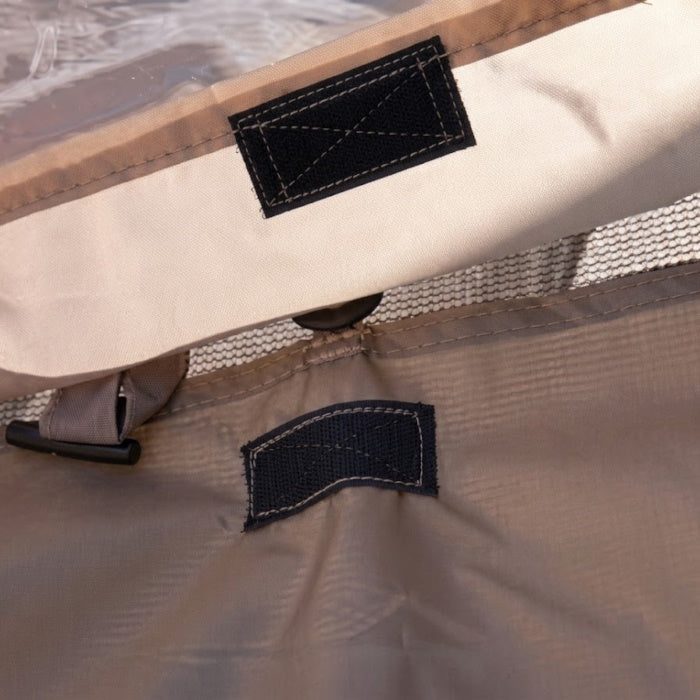 Load image into Gallery viewer, Close-up of black Velcro strips for securing a khaki Picnic Windows shelter panel
