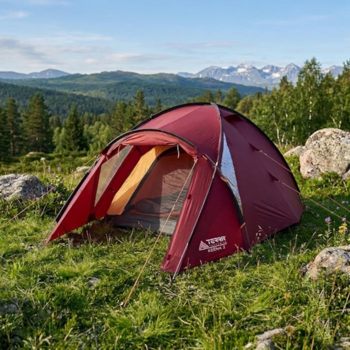 Load image into Gallery viewer, Cherry Ksena 2 tent pitched on a rocky mountain slope with forest background
