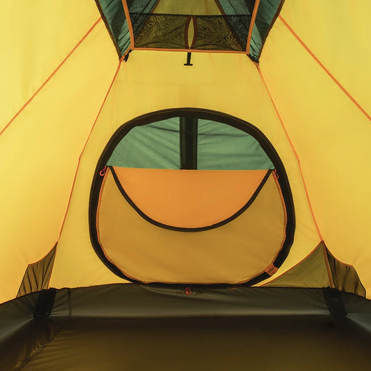 Interior view of yellow Ksena 2 tent showing a round zipped door and mesh pocket