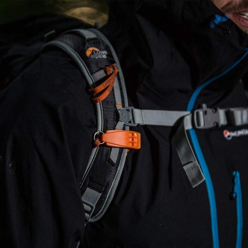 Load image into Gallery viewer, Person wearing a black backpack with orange accents and Lowe Alpine logo.
