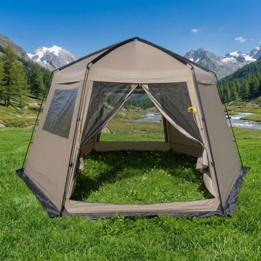 A khaki Picnic Shelter with a transparent PVC window panel set up in the mountains