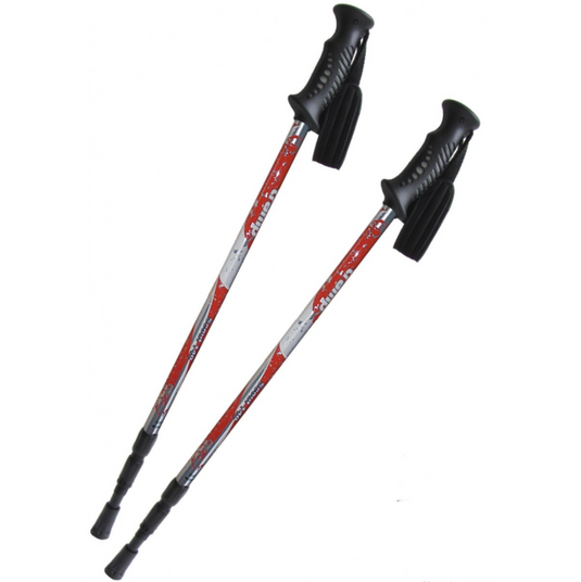 Two red and black hiking poles on a white background