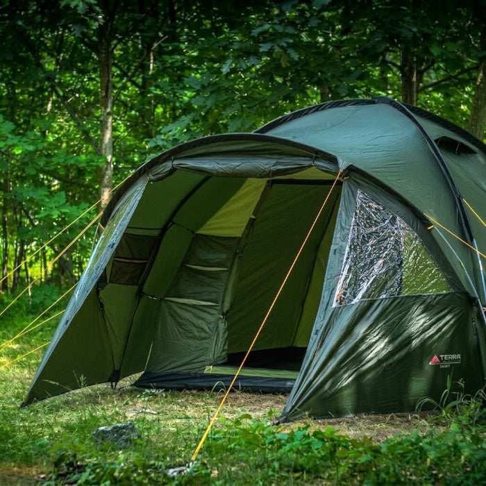 Load image into Gallery viewer, Green camping tent set up in a forest

