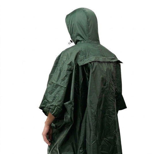 Rear view of a man wearing a dark green waterproof rain poncho with a deep hood